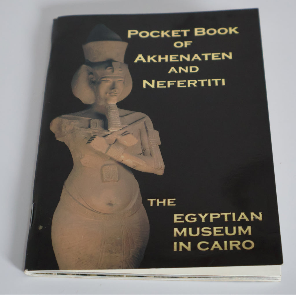Book titled 'Pocket Book of Akhenaten and Nefertiti' from The Egyptian Museum in Cairo on a white background